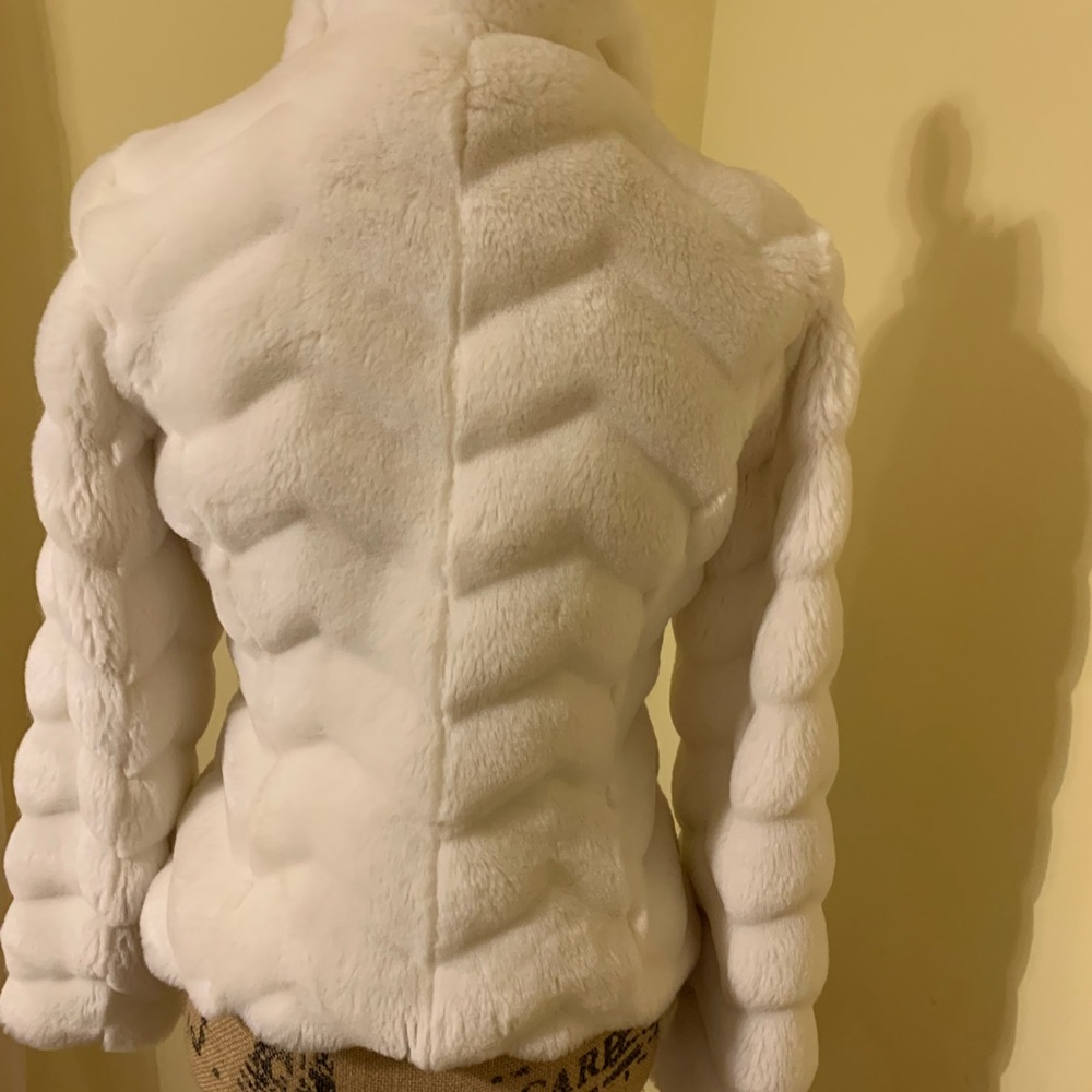 Cream fur coat from White House black market.